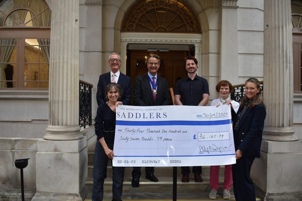 Saddlers' Company news: Camilla Lywood Presents Cheque for 34000 to Sheila Scott of Shelter from the Storm